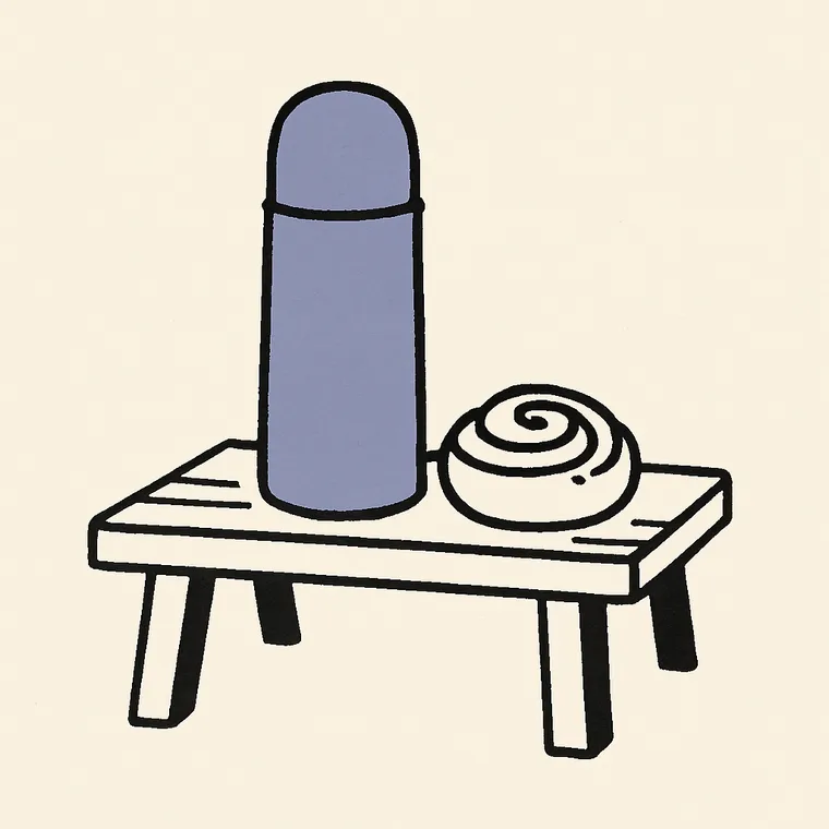 A thermos and a cinnamon bun on a bench